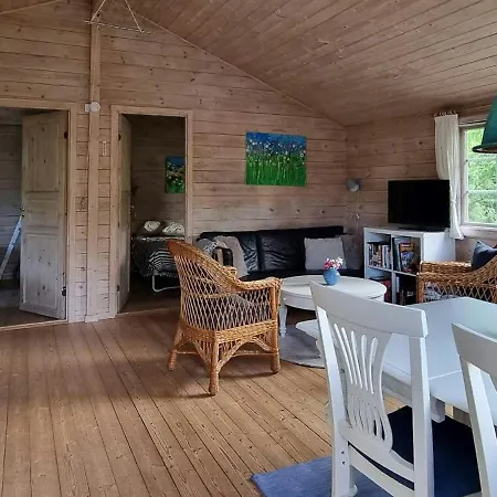 Blue Cottage On Idyllic Asko Maribo