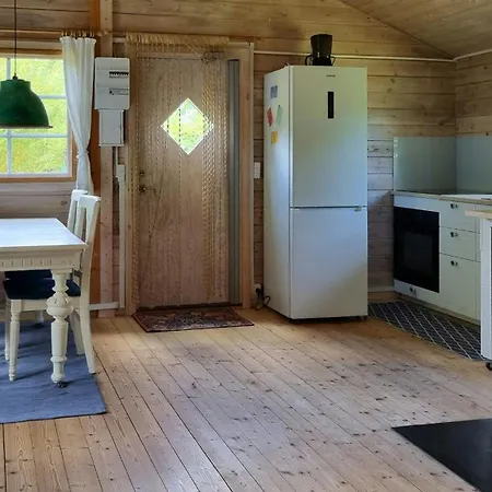 Blue Cottage On Idyllic Asko